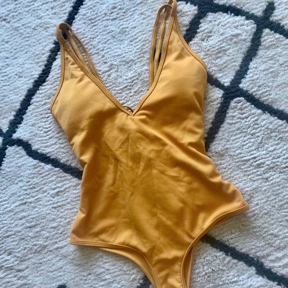Strappy, one-piece yellow bathing suit!